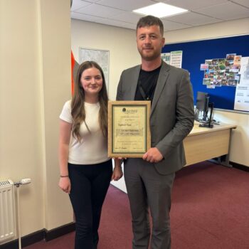 Student being presented with a certificate