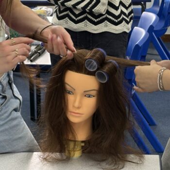 Students practising hairdressing skills