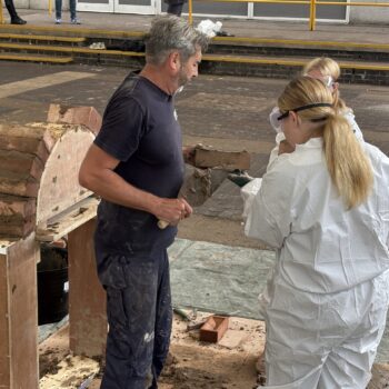 Students laying bricks